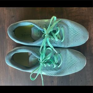 Teal Nike Free RN sneakers